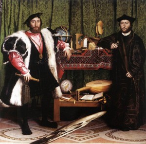 Two men standing either side of a still life set on wooden shelves - distorted skull in foreground